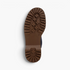 Beach Rose Co. suede ankle boot showing the brown chunky lug sole tread pattern from a bottom view