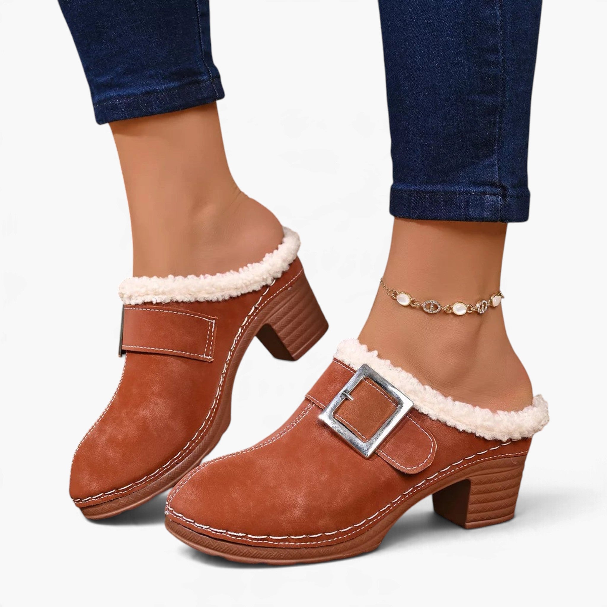 Beach Rose Co. brown suede clogs with fluffy white trim, oversized buckle, and chunky block heel on a model.