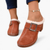 Beach Rose Co. brown suede clogs featuring fluffy white trim, an oversized silver buckle, and a chunky block heel.