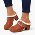 Beach Rose Co. brown suede clogs with fluffy white trim, oversized buckle, and chunky block heel on a model.