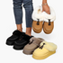 Beach Rose Co. suede platform clogs with faux fur trim, moccasin stitching, and tassels in black, tan, and yellow.