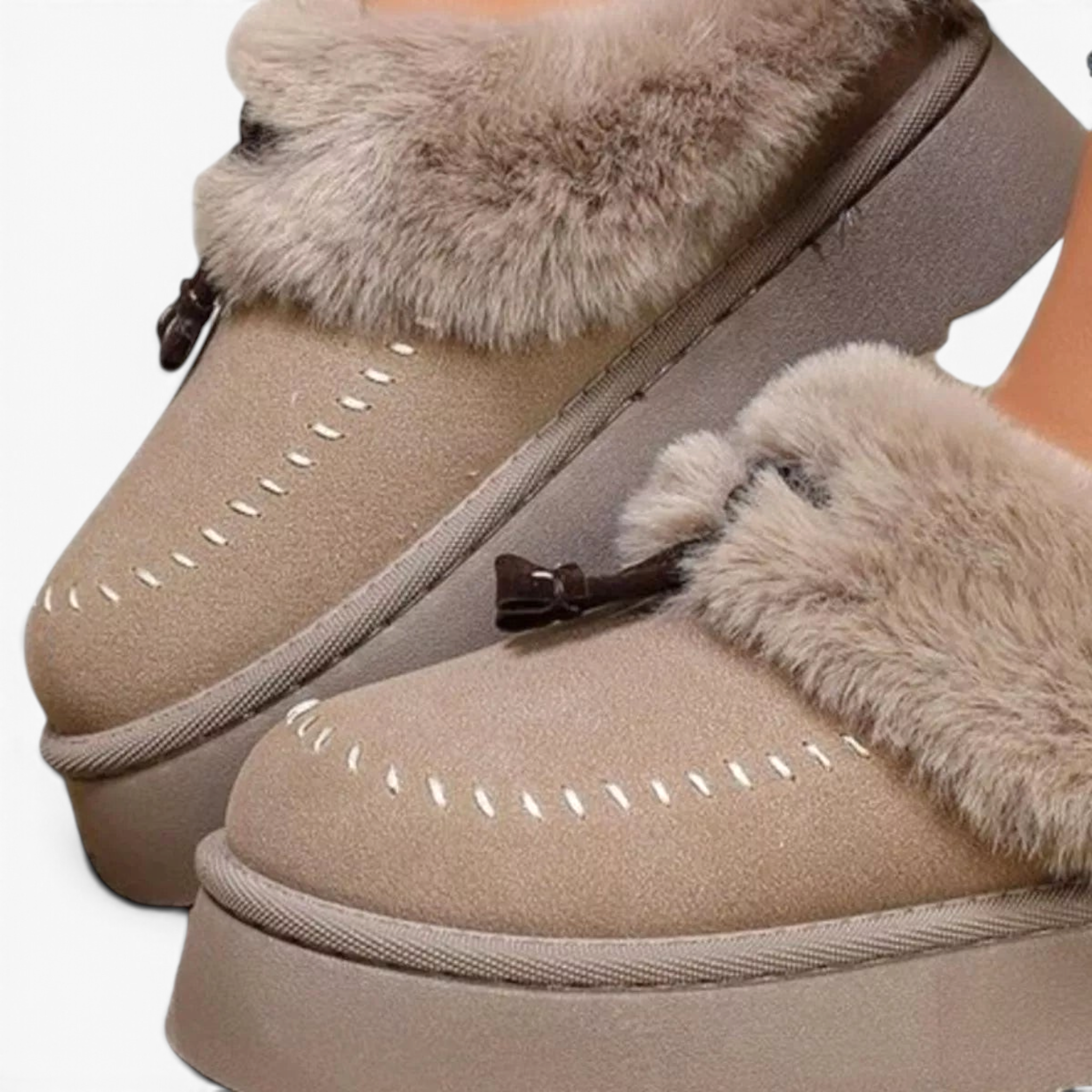 Beach Rose Co. beige suede platform clogs with plush faux fur trim, moccasin stitching, and decorative tassels.
