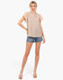 Beach Rose Co. tan striped top with floral flutter sleeves worn by a model with denim shorts and clear heels