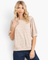 Beach Rose Co. tan textured puff sleeve top with a round neckline and banded hem worn by a blonde model.