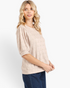 Beach Rose Co. tan textured top with elbow-length puff sleeves and a round neckline worn by a blonde model.