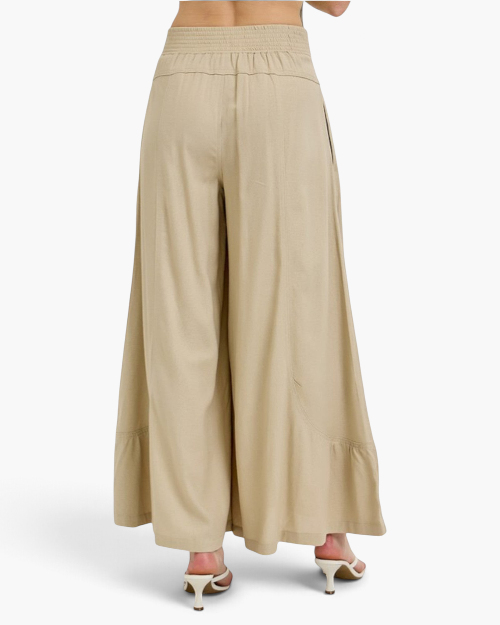 Beach Rose Co. tan wide leg pants in a rayon linen blend with a smocked back waistband and curved seam details.