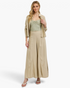 Beach Rose Co. tan wide leg pants in a rayon-linen blend featuring curved seams and a gathered hem on a blonde model.