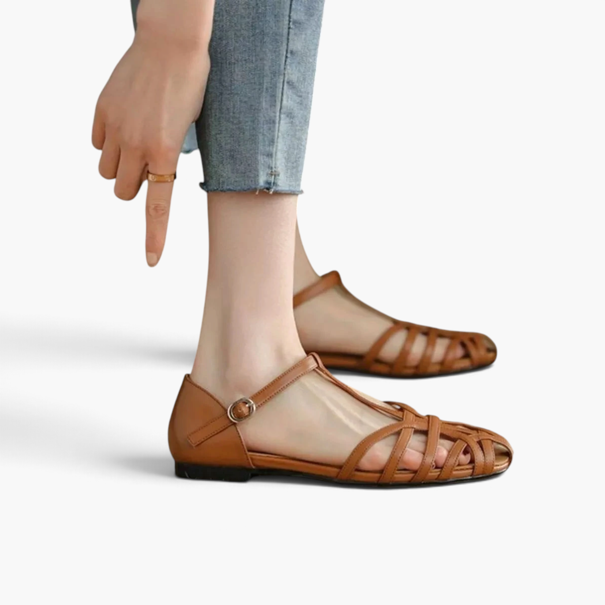 Beach Rose Co. tan PU leather T-bar flat sandals with an interwoven caged strap design and adjustable buckle.