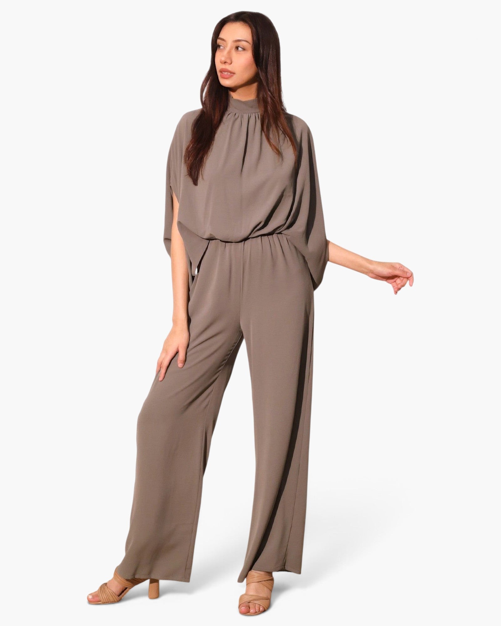 Beach Rose Co. taupe textured mock neck caftan jumpsuit with wide legs and flowing silhouette on a model