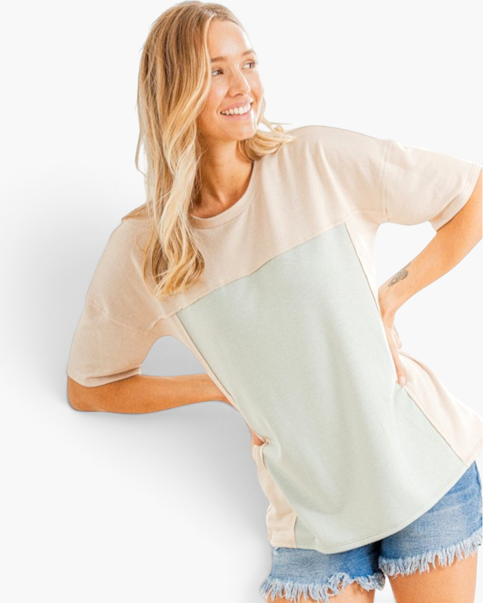Beach Rose Co. relaxed fit taupe and light gray colorblock short sleeve tee worn by a smiling woman with denim shorts
