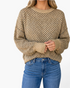 Beach Rose Co. taupe and charcoal diamond knit sweater with a round neckline and relaxed fit worn with blue jeans.