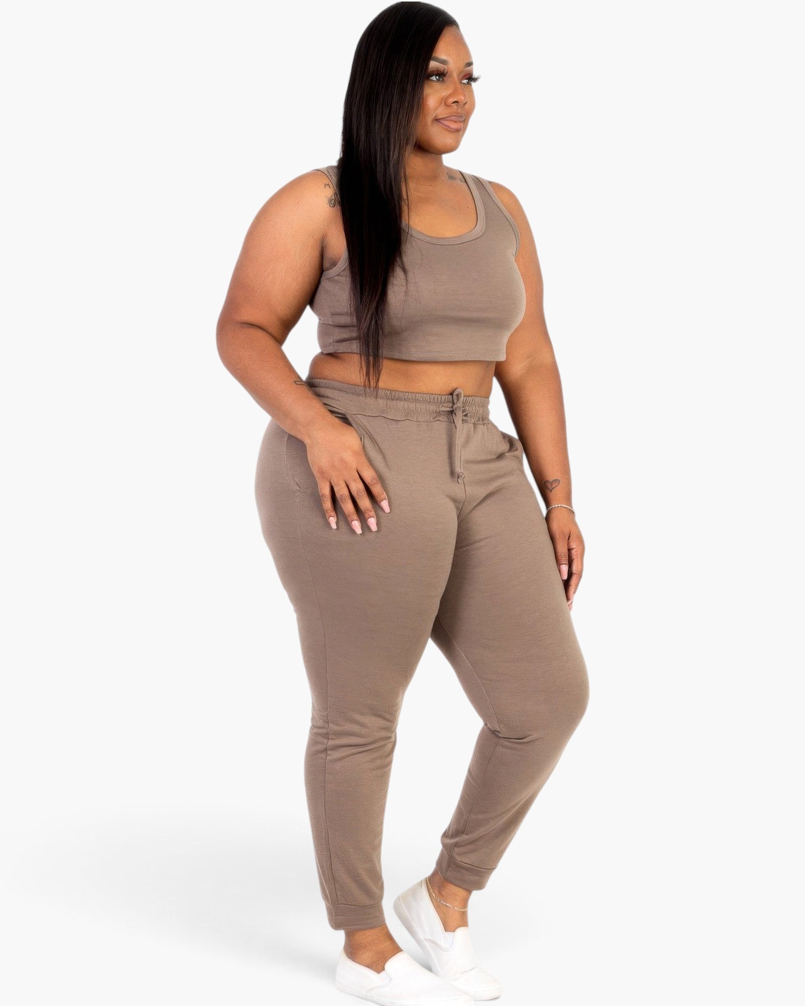 Beach Rose Co. plus size taupe French terry cropped tank top and joggers set worn by a model with white sneakers