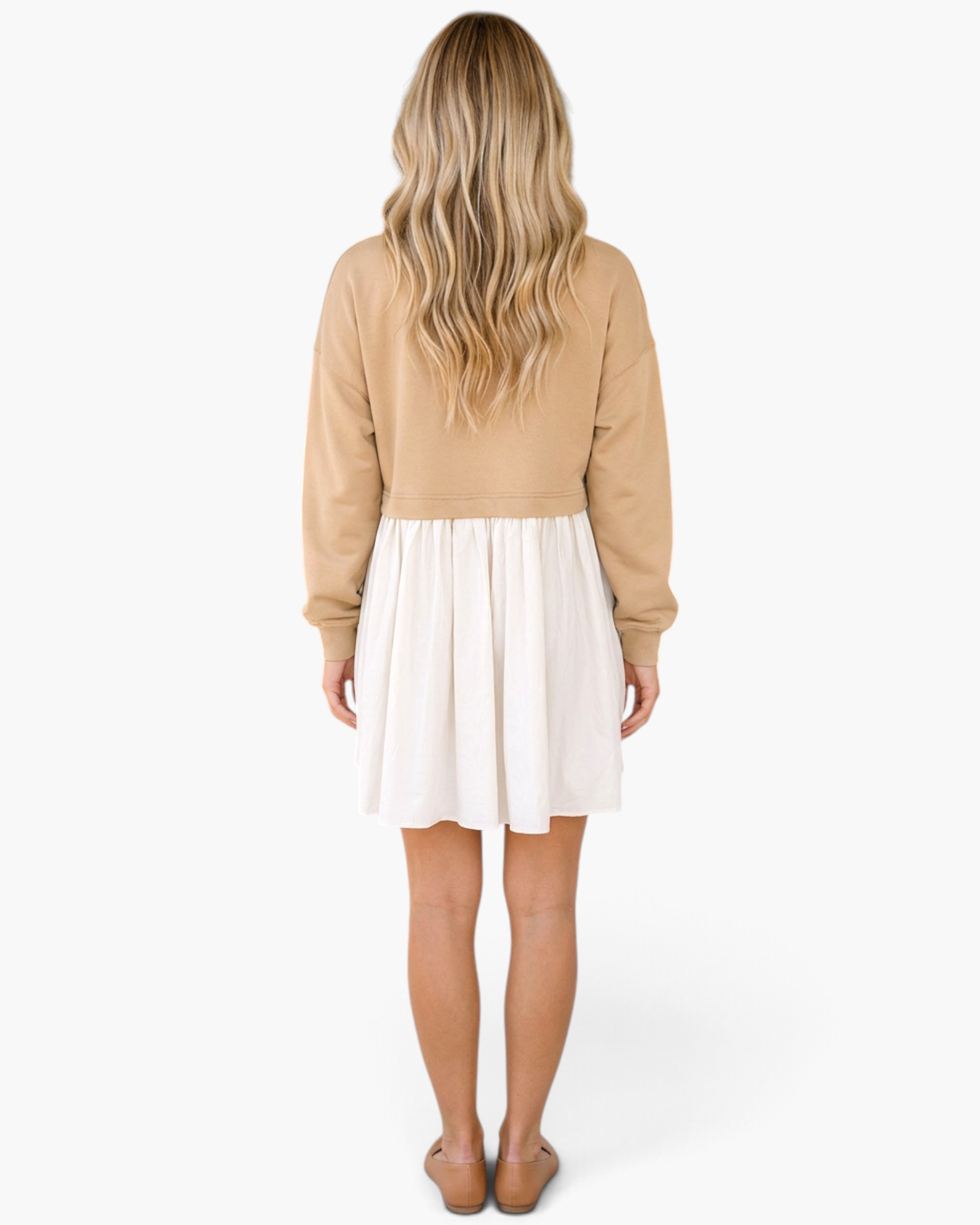 Back view of a woman wearing a Beach Rose Co. taupe sweatshirt bodice dress with a gathered ivory mini skirt.