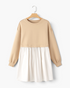Beach Rose Co. taupe sweatshirt bodice mini dress with a gathered ivory woven skirt and long ribbed sleeves.