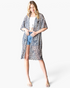 Beach Rose Co. taupe leopard print duster kimono with an open front and elbow-length sleeves on a blonde model