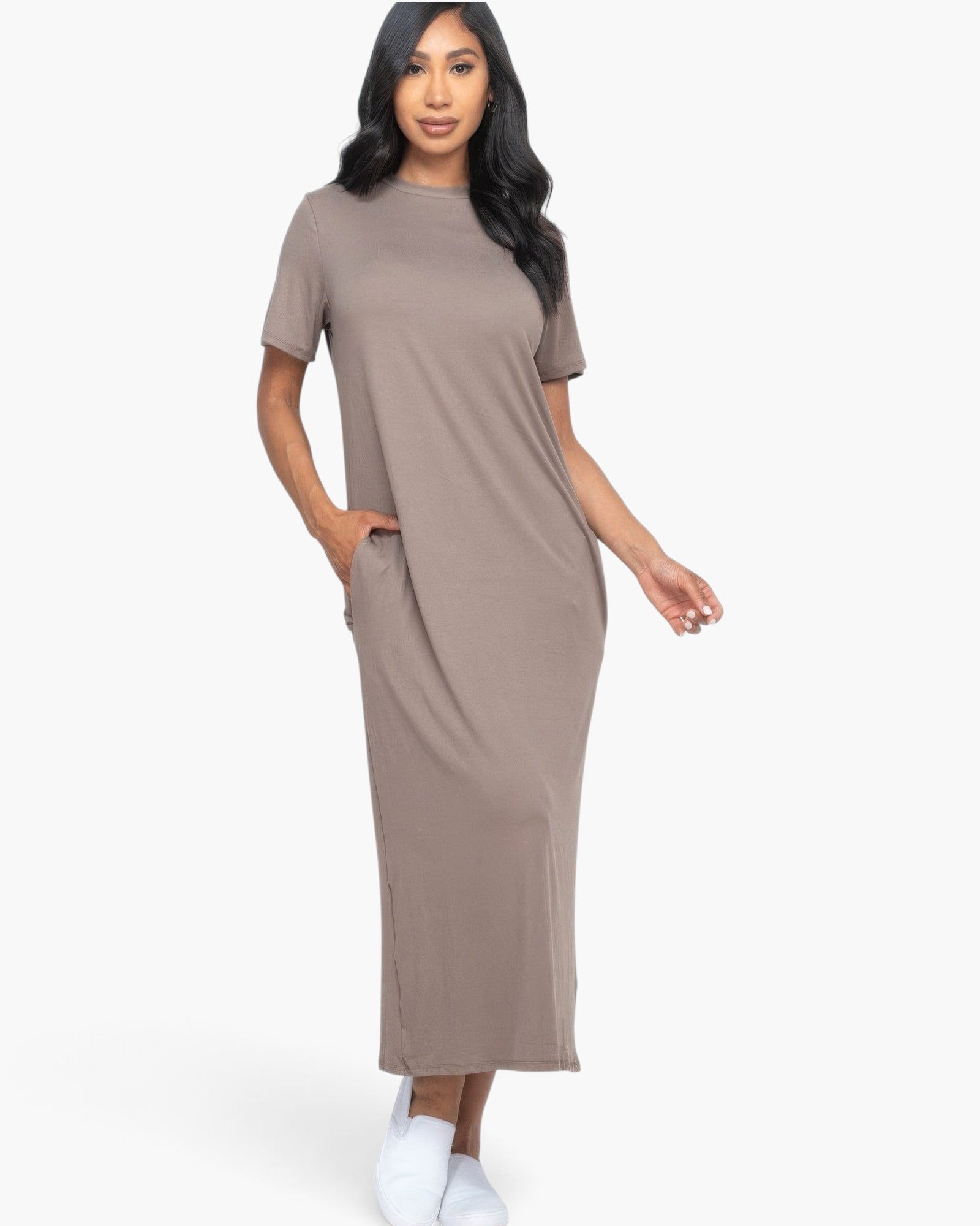 Beach Rose Co. taupe midi tee dress with short sleeves and side pockets worn by a model on a white background