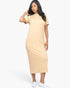 Beach Rose Co. taupe midi tee dress with short sleeves and side pockets worn by a model with white slip-on sneakers.