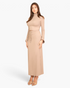 Beach Rose Co. taupe mock neck crop top and maxi skirt set with bell sleeves worn by a woman on a white background.