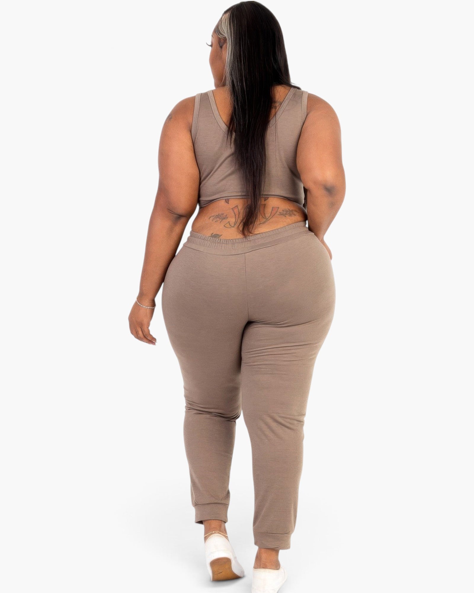 Beach Rose Co. plus size taupe French terry cropped tank top and joggers set worn by a model, back view