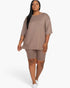 Beach Rose Co. plus size taupe loose fit top and biker shorts set on a model against a white background