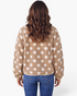 Back view of a model wearing a Beach Rose Co. taupe teddy jacket with cream polka dots and a relaxed fit.
