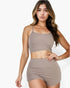 Beach Rose Co. taupe ribbed cami crop top and matching ruched shorts set worn by a woman with long wavy hair.