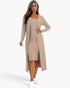 A woman wearing a taupe Beach Rose Co. ribbed midi bodycon dress and matching long cardigan with white sneakers.