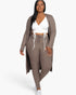 Beach Rose Co. plus size taupe ribbed long cardigan and leggings set worn by a woman with a white crop top