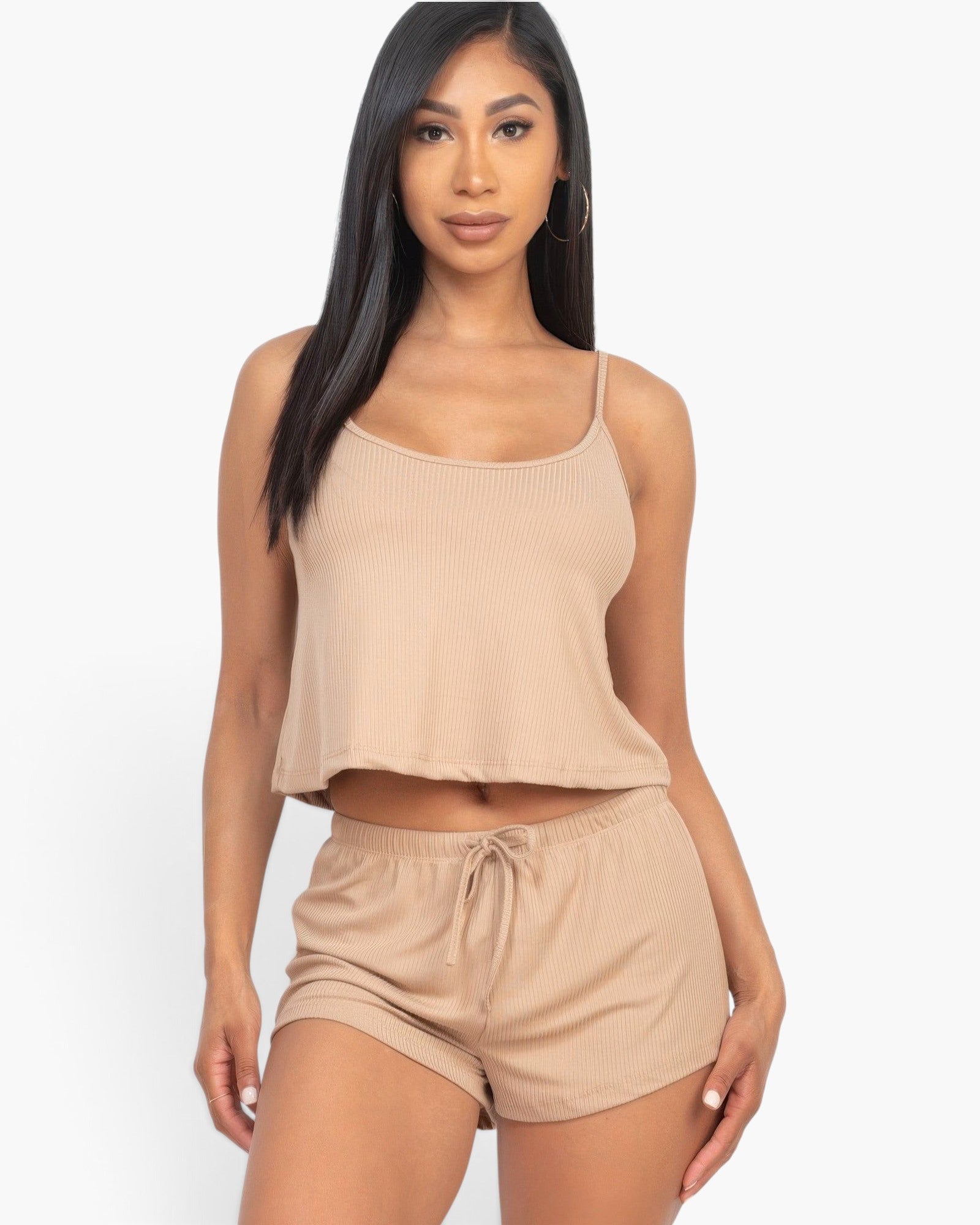 Model wearing a Beach Rose Co. taupe ribbed strappy top and matching drawstring shorts set in a studio setting.