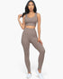 Beach Rose Co. taupe ribbed crop top and high-waisted leggings set worn by a model against a white background.
