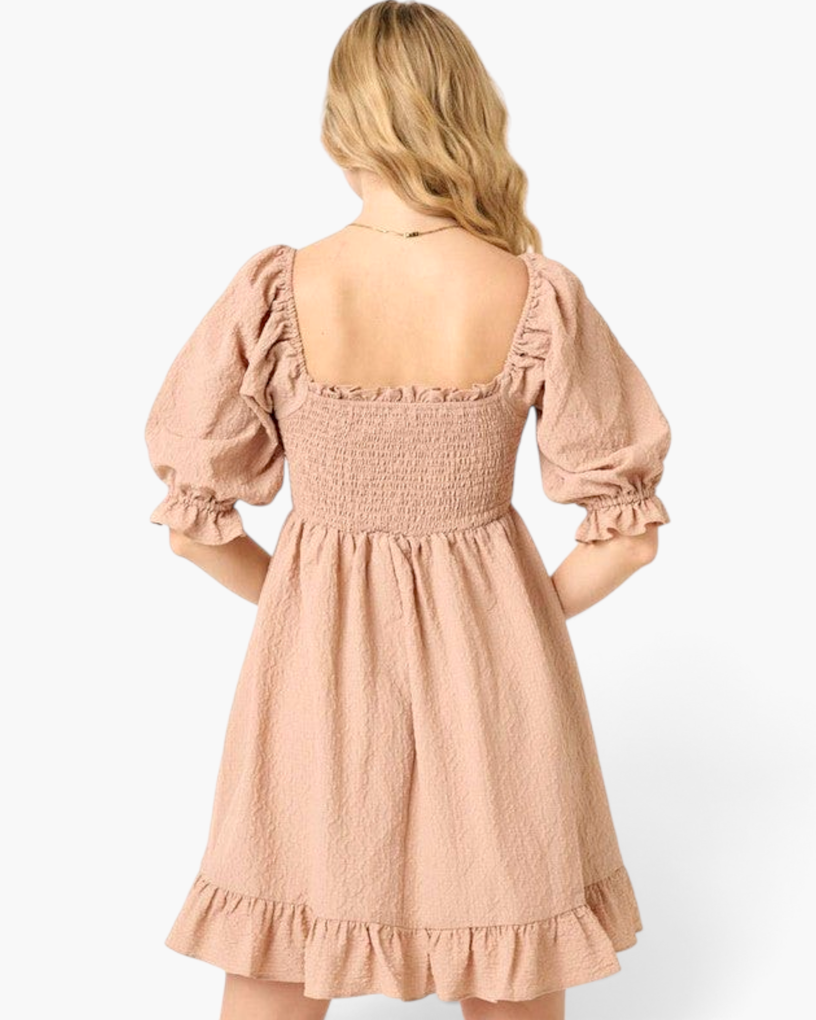 Beach Rose Co. taupe mini dress with smocked bodice, square neckline, and puff sleeves, viewed from the back.
