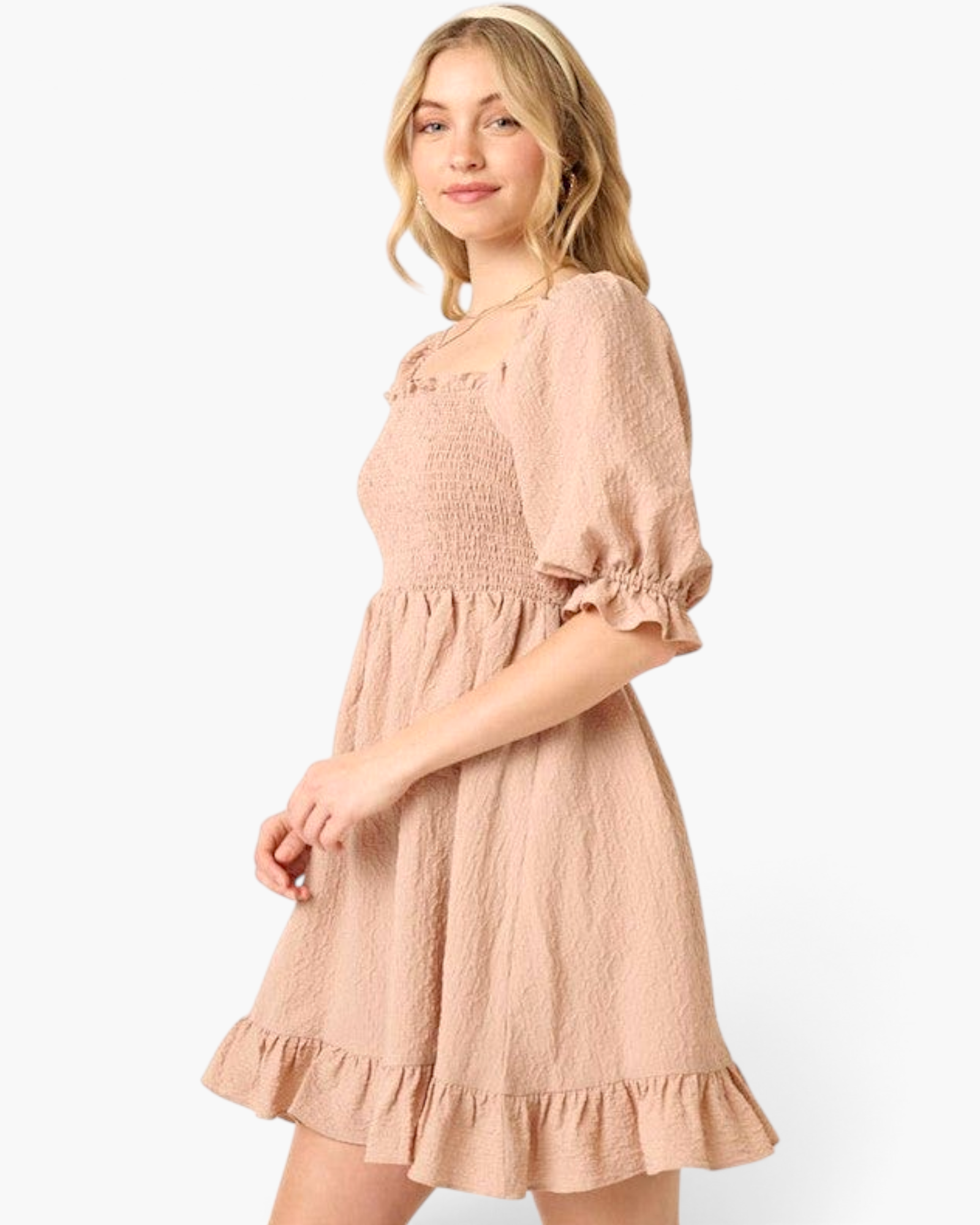 Beach Rose Co. taupe mini dress with smocked bodice, puff sleeves, and ruffled hem worn by a blonde model