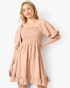 Beach Rose Co. taupe mini dress with a smocked bodice, square neckline, and puff sleeves in textured woven fabric.