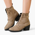 Beach Rose Co. taupe suede ankle boots featuring a lace-up front, side buckle strap, and a chunky black block heel.