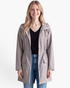 Beach Rose Co. taupe waterproof hooded rain jacket with a zip-front, flap pockets, and gathered waist on a model.