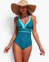 Beach Rose Co. one-piece swimsuit in teal and turquoise with a V-neckline and straw sun hat on a model