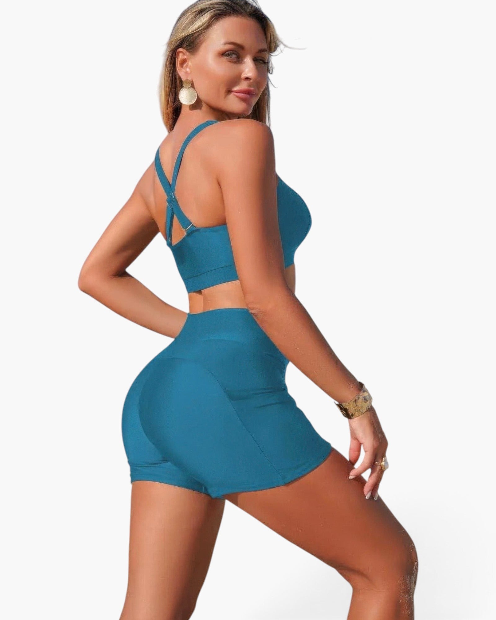 Beach Rose Co. teal two-piece bikini with crisscross back straps and tummy control shorts on a model.