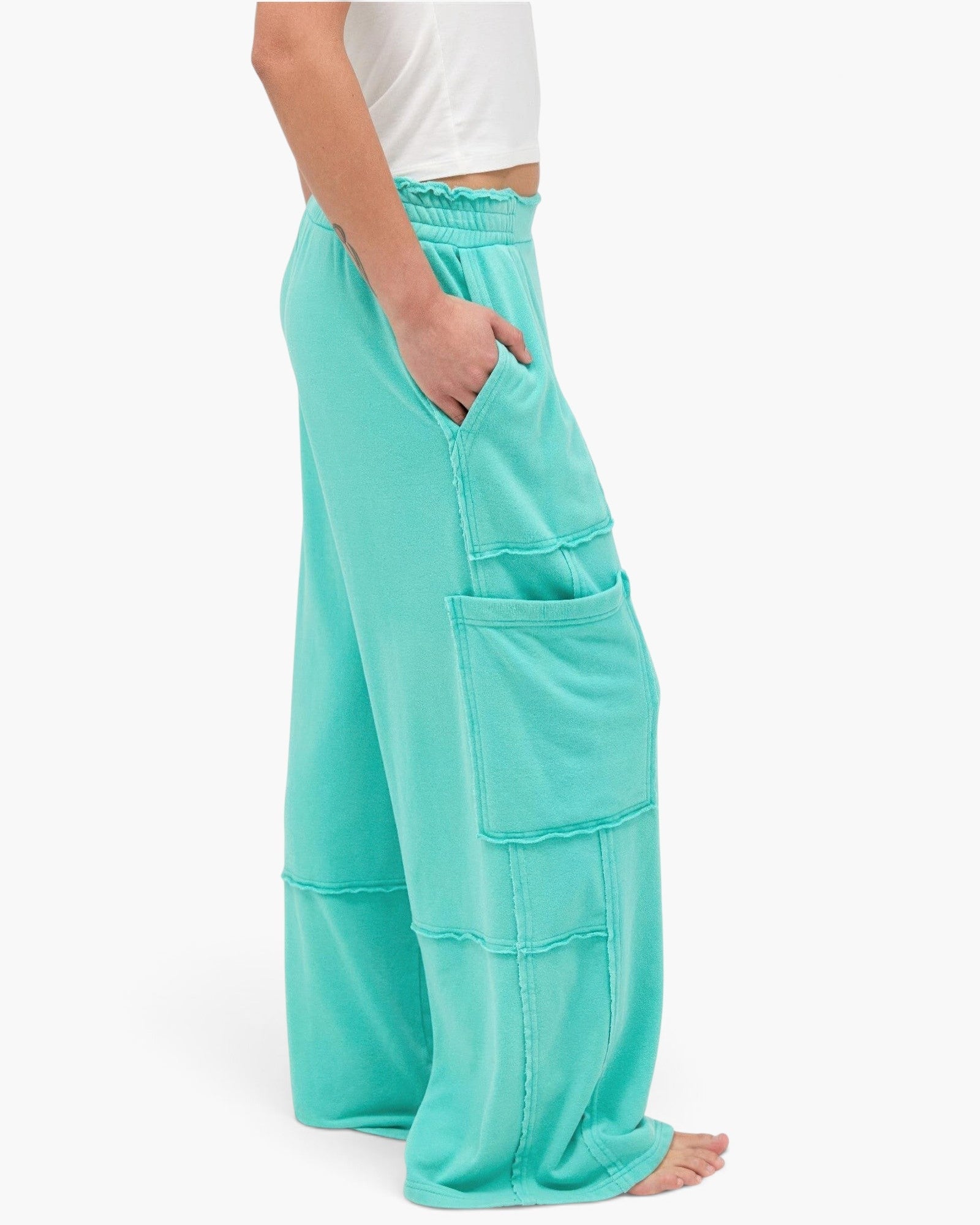 Beach Rose Co. teal mineral wash wide leg cargo pants with raw edge patch pockets and high-rise elastic waistband