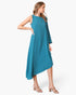 Beach Rose Co. teal matte crepe one-sleeve dress with an asymmetrical hem worn by a model in beige heeled sandals.