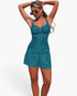 Beach Rose Co. teal two-piece swimsuit with sling straps, pleated bodice, and shorts for a flattering beach look.