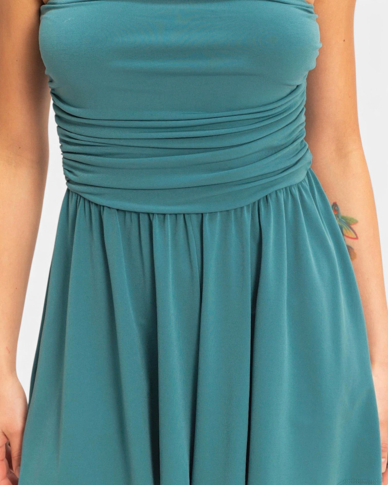 Beach Rose Co. teal strapless romper with a shirred waist and soft, stretchy fabric for a flattering fit.