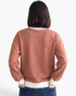 Beach Rose Co. rust brown crewneck sweatshirt with striped trim on the neckline, cuffs, and hem, back view.