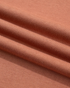 Close-up of Beach Rose Co. sweatshirt fabric in a soft terracotta colour showing the smooth cotton-polyester texture