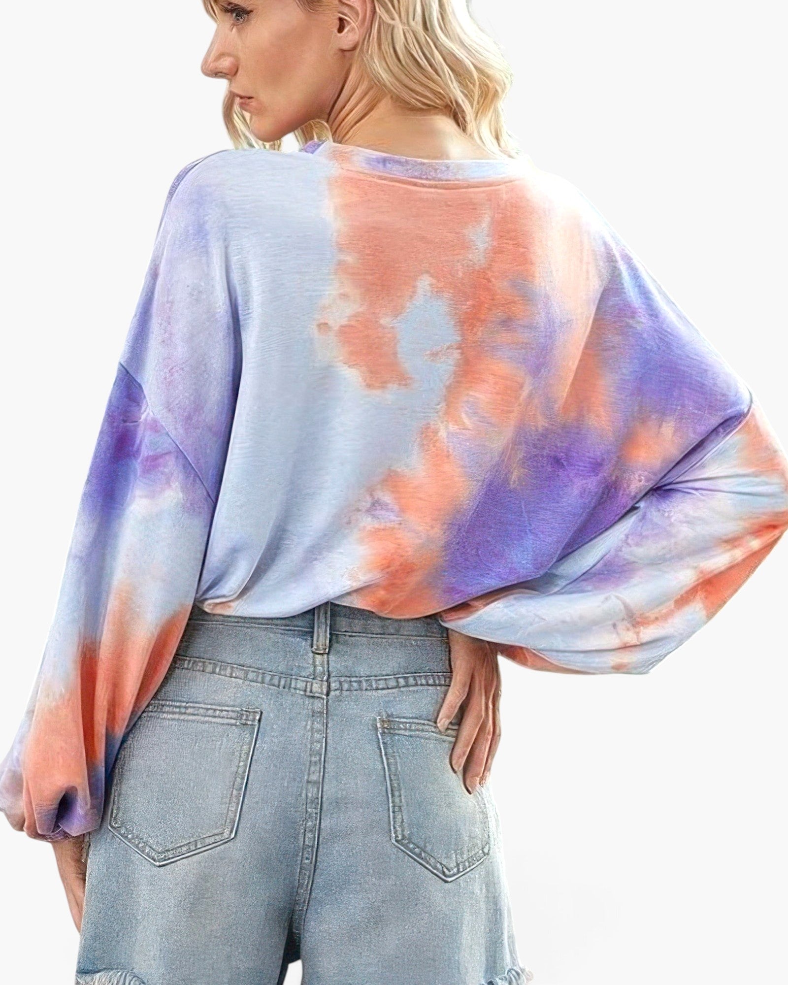 Beach Rose Co. tie-dye long balloon sleeve top in purple and orange worn with denim shorts