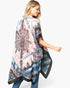 Beach Rose Co. tie-dye boho kimono with black mandala print, worn by a blonde woman against a white background.