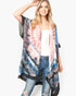 Beach Rose Co. model wearing a lightweight, open-front tie-dye boho kimono with pink, blue, and black patterns.