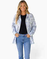 Beach Rose Co. light blue and white tie-dye corduroy shacket with button-front and chest pockets on a smiling model