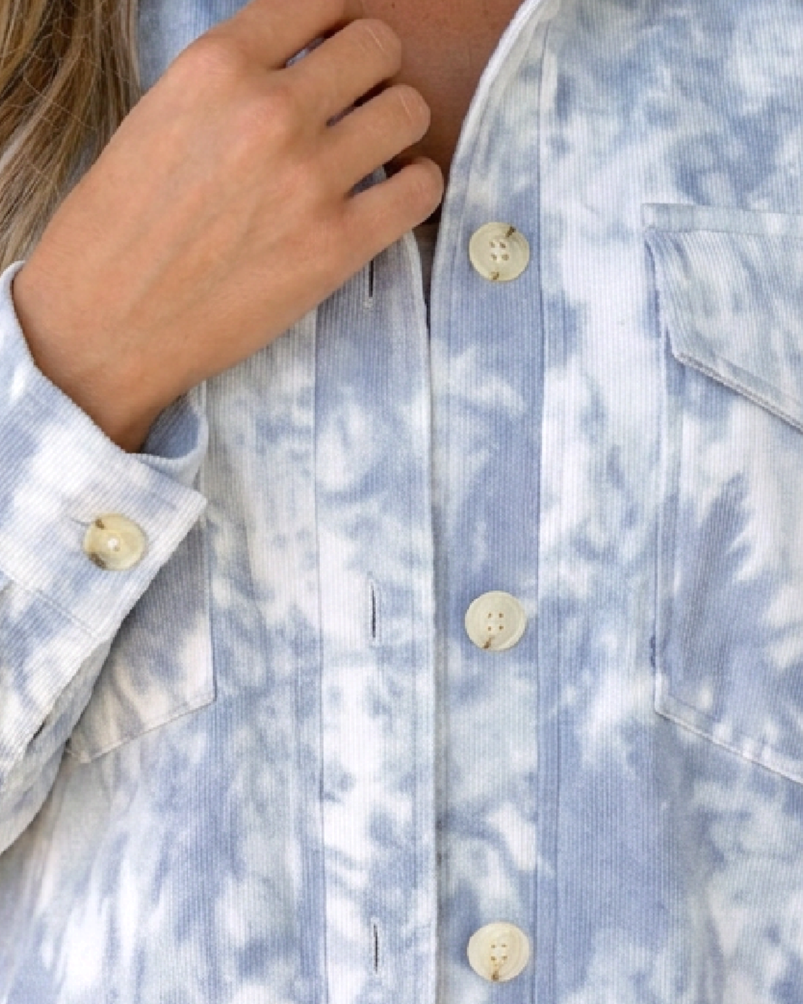 Beach Rose Co. light blue and white tie-dye corduroy shacket featuring a button-front closure and chest pockets.