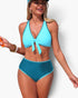 Beach Rose Co. two-piece bikini with a light blue tie-front halter top and high-waisted dark teal scalloped bottoms.