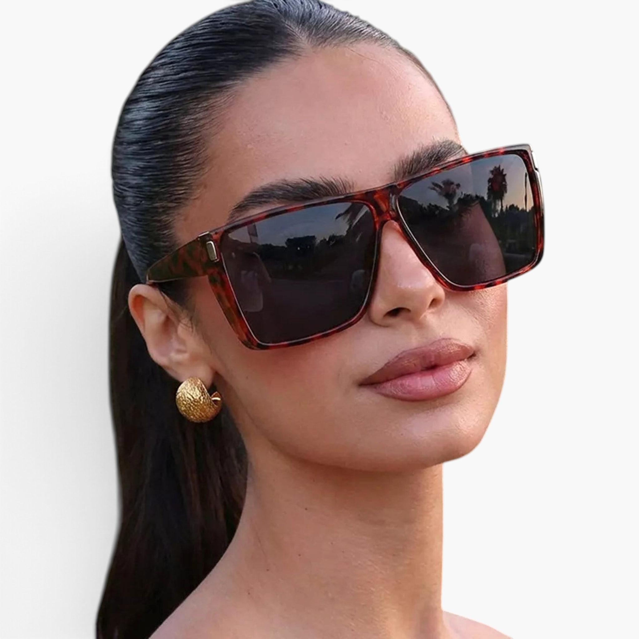 Beach Rose Co. oversized flat-top square sunglasses in tortoiseshell print worn by a woman with gold hoop earrings.